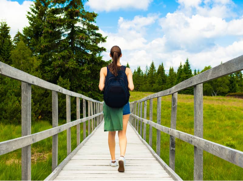 Woman walking on a nature trail